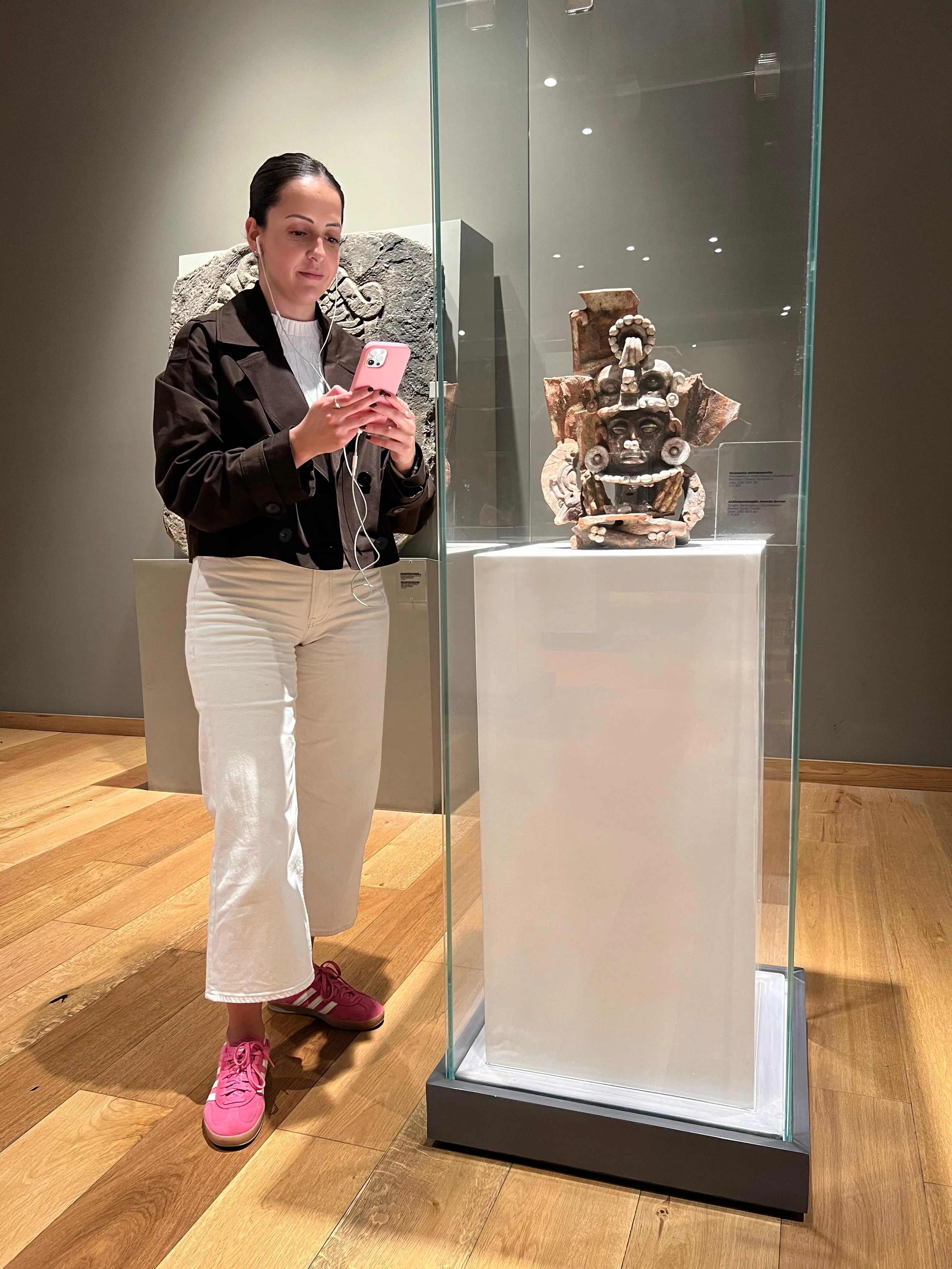 Visitor using Musa next to the censer exhibit